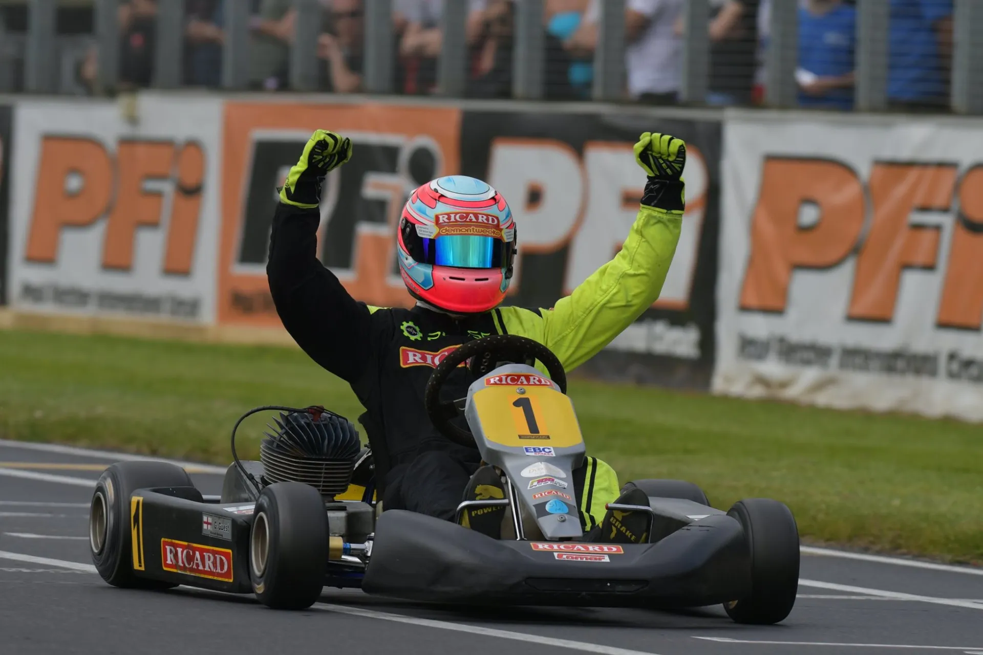 Glenn Guest celebrating a win at PF International with both arms raised