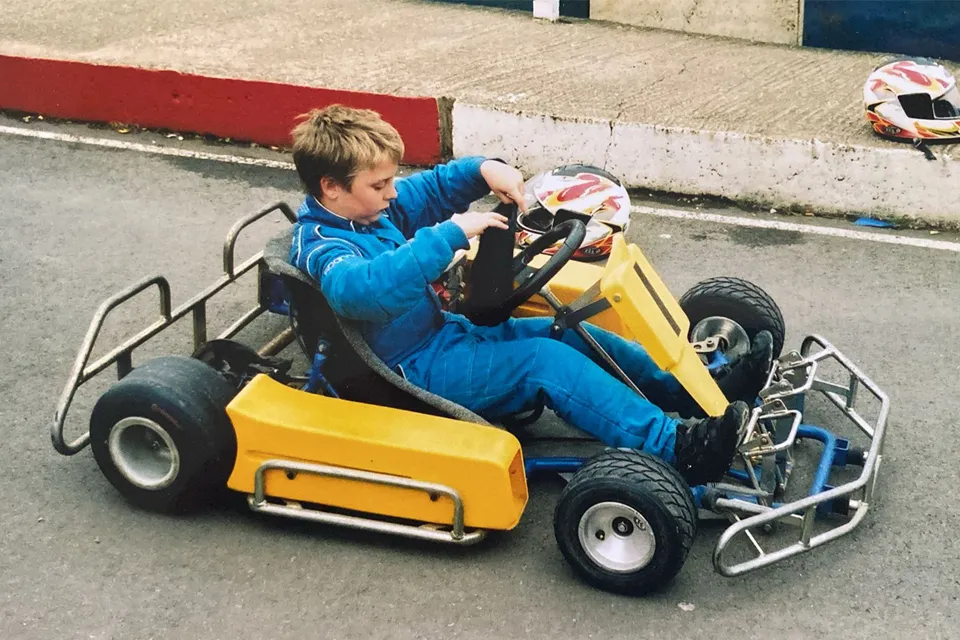 A young Glenn Guest sitting in a yellow cadet kart at Stretton