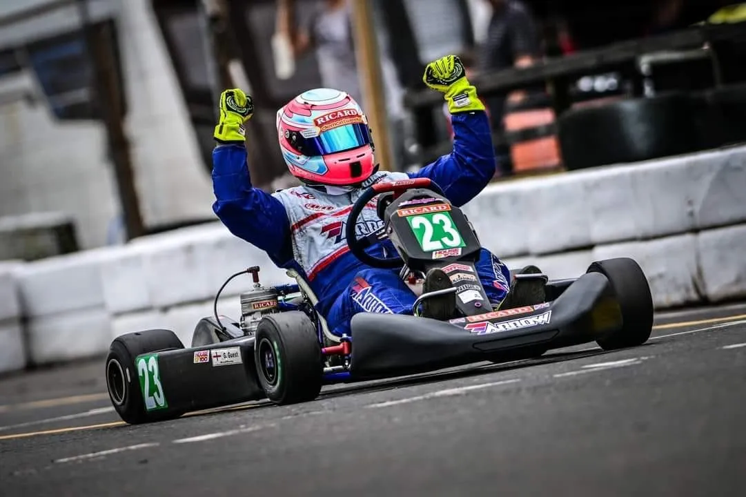 Glenn with both arms raised in the #23 kart