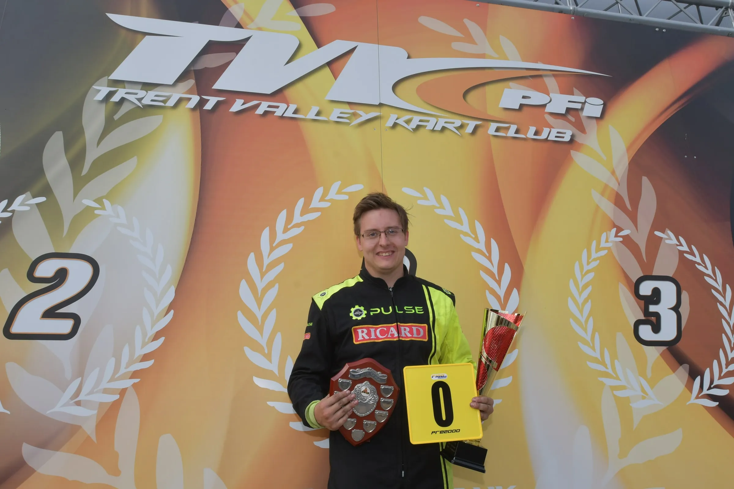 Glenn on the Trent Valley Kart Club podium at PFi holding the O Plate trophy