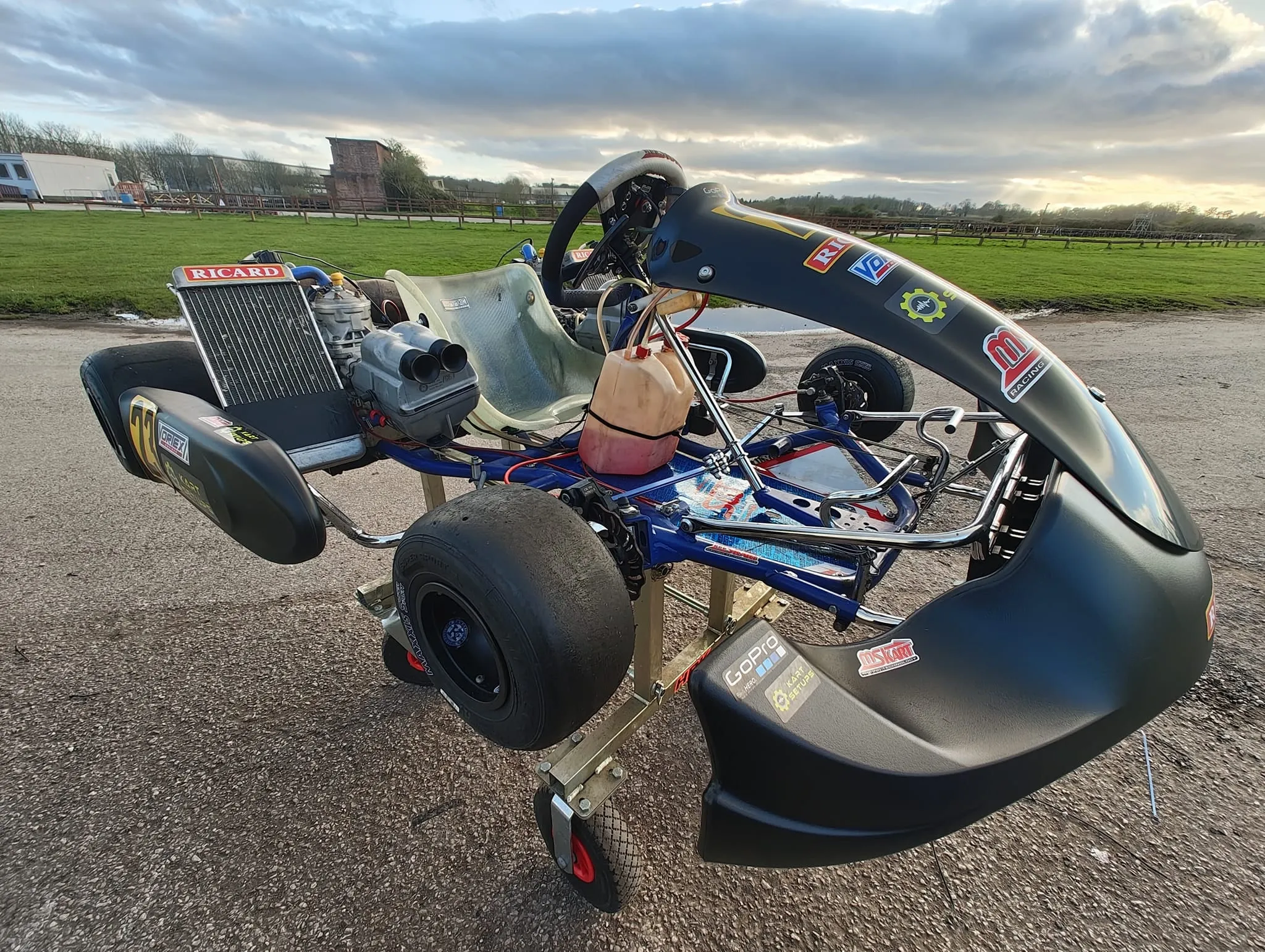 The twin-engine OK kart on its stand at the circuit